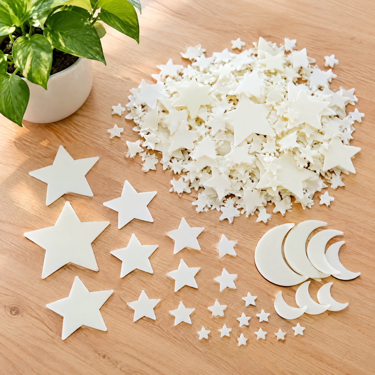 Star stickers in assorted sizes on a wooden table