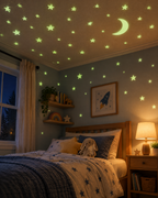 Glowing stars and moon on a bedroom ceiling at night