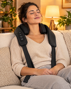 Neck and shoulder massager in use on a sofa
