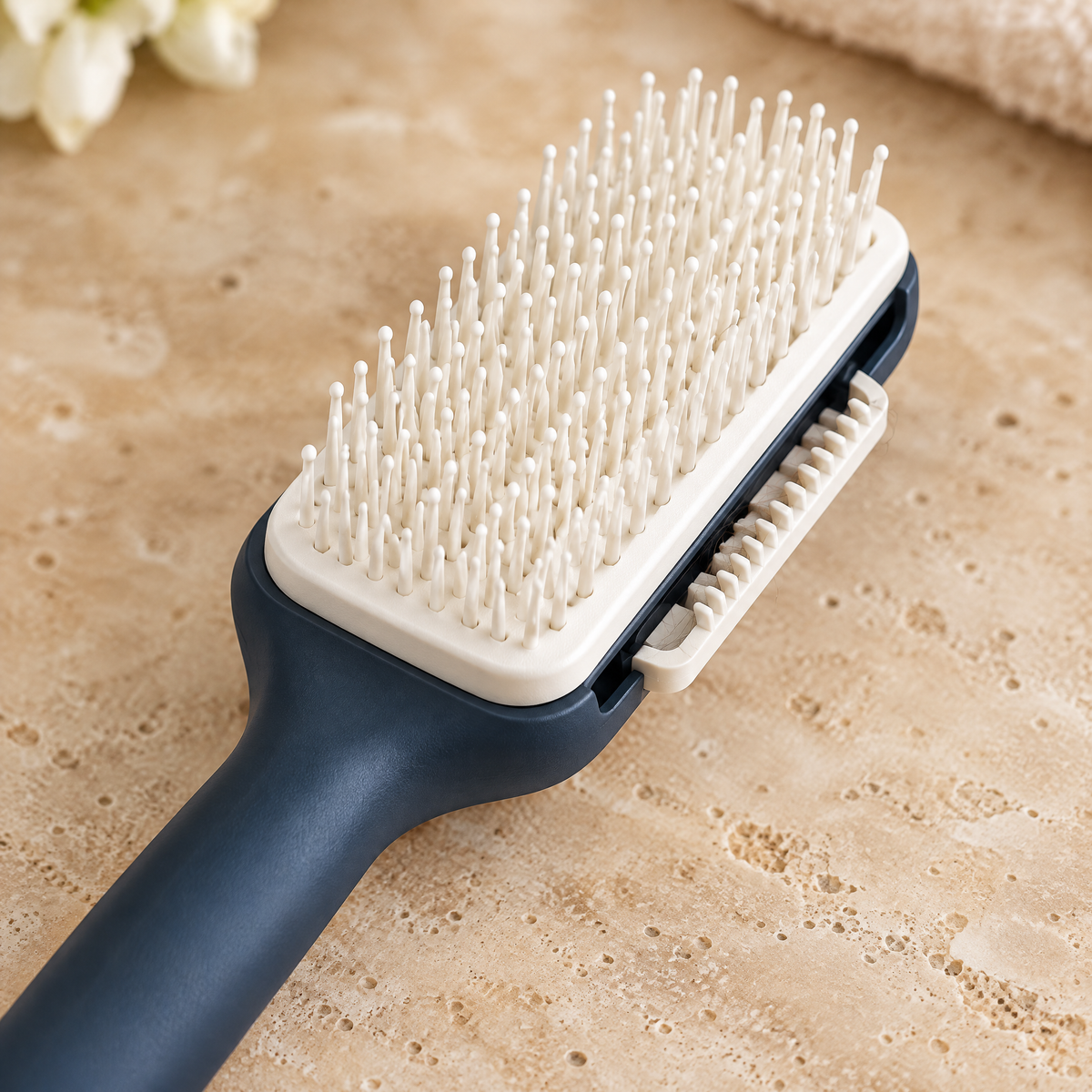 Close-up of the hairbrush bristles and cleaning mechanism