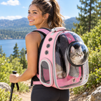 A young woman hiking a scenic park trail wearing the pet backpack with the clear bubble window