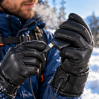 Close-up of hands wearing the USB heated touchscreen gloves showing the USB cable plugging into a power bank