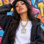 A young woman in an oversized streetwear outfit wearing the iced face pendant chain
