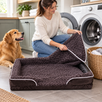 A person unzipping the removable cover of the waterproof dog bed to toss it in the washing machine