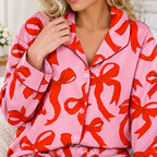 Close-up of the bow print fabric and contrast piping on the pajama shirt cuffs and buttons