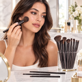 Makeup brush set in use at a vanity