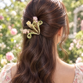 Metal flower hair clip worn