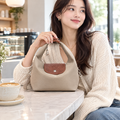 Braided nylon dumpling bag in a cafe